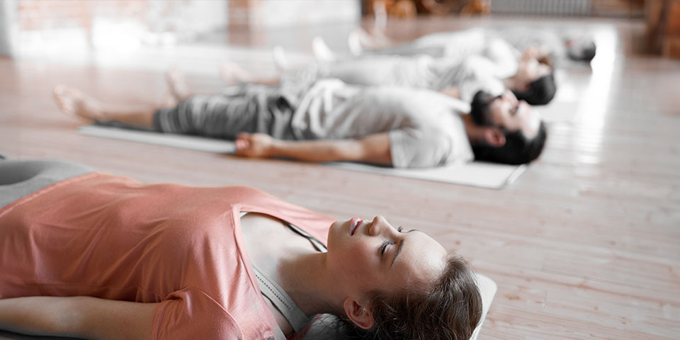 Promote Relaxation and Mental Wellbeing with Our Yoga Instructor Course at TRAINFITNESS